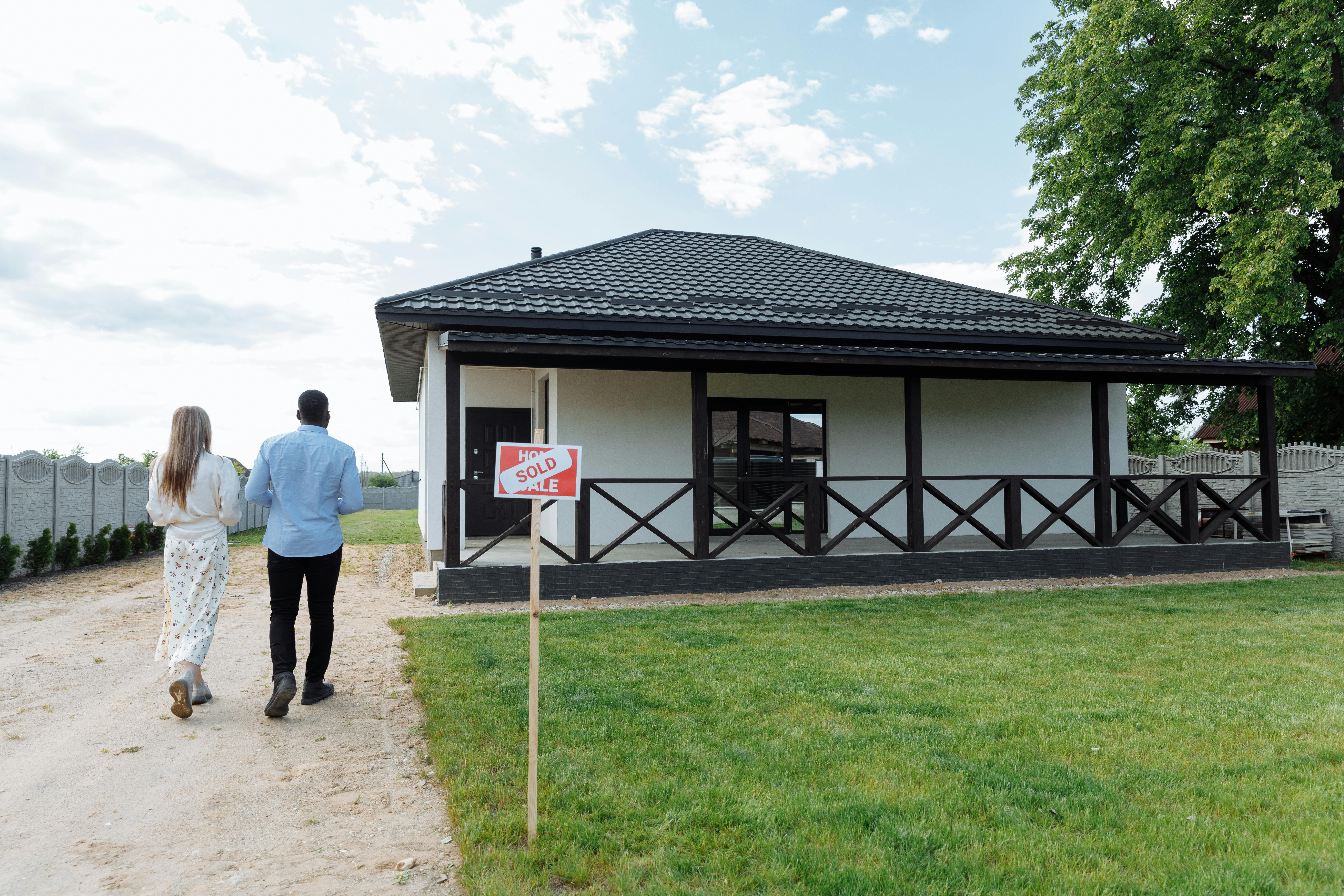 Couple walking up to house they closed on