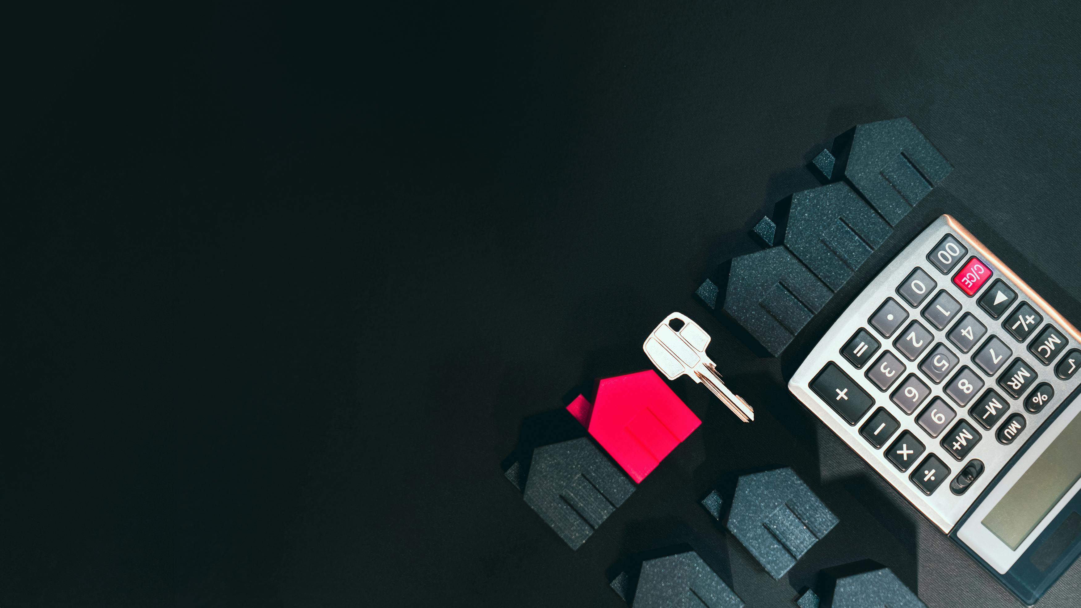 Graphic with houses, keys, and a calculator