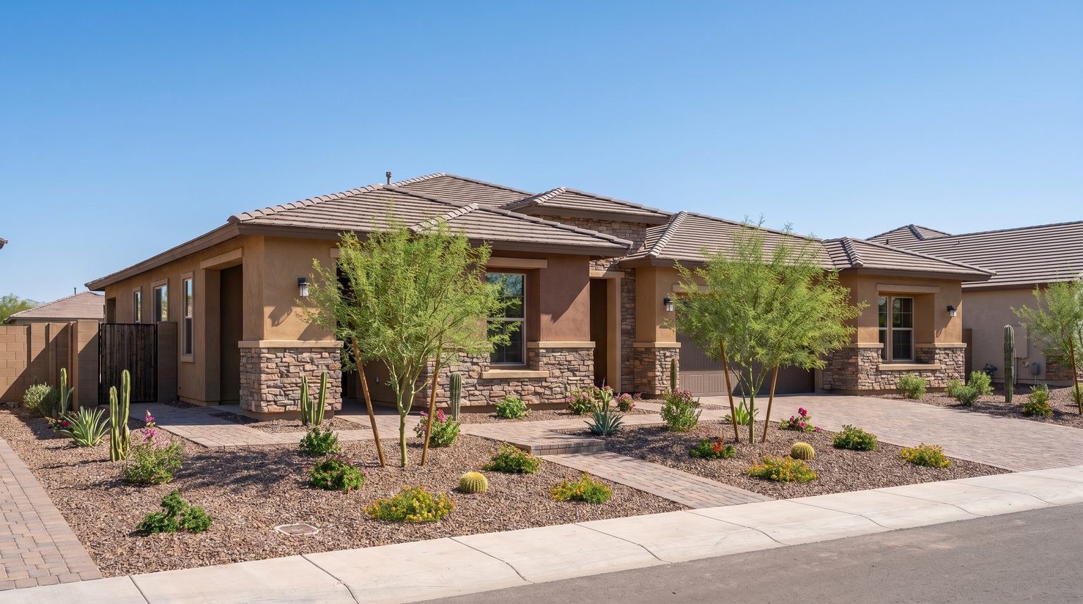 Modern single-family homes with desert landscaping and mountain views in Ahwatukee, Arizona, representing newer construction inventory