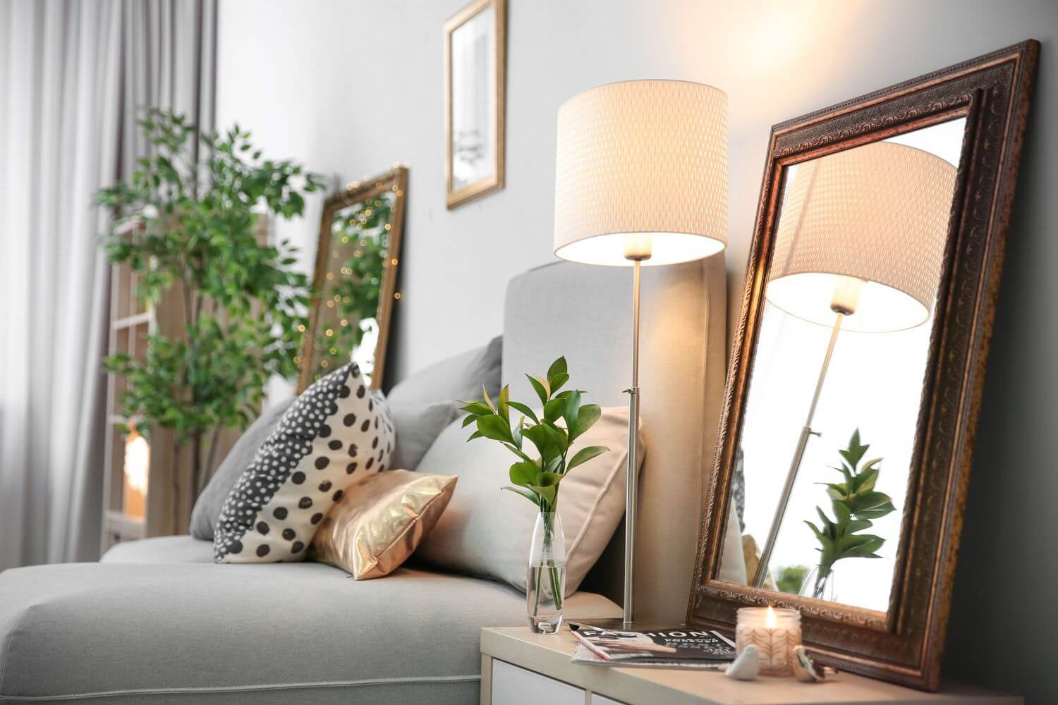 cozy-living-room-corner-floor-lamp-decorative-mirror-soft-textiles