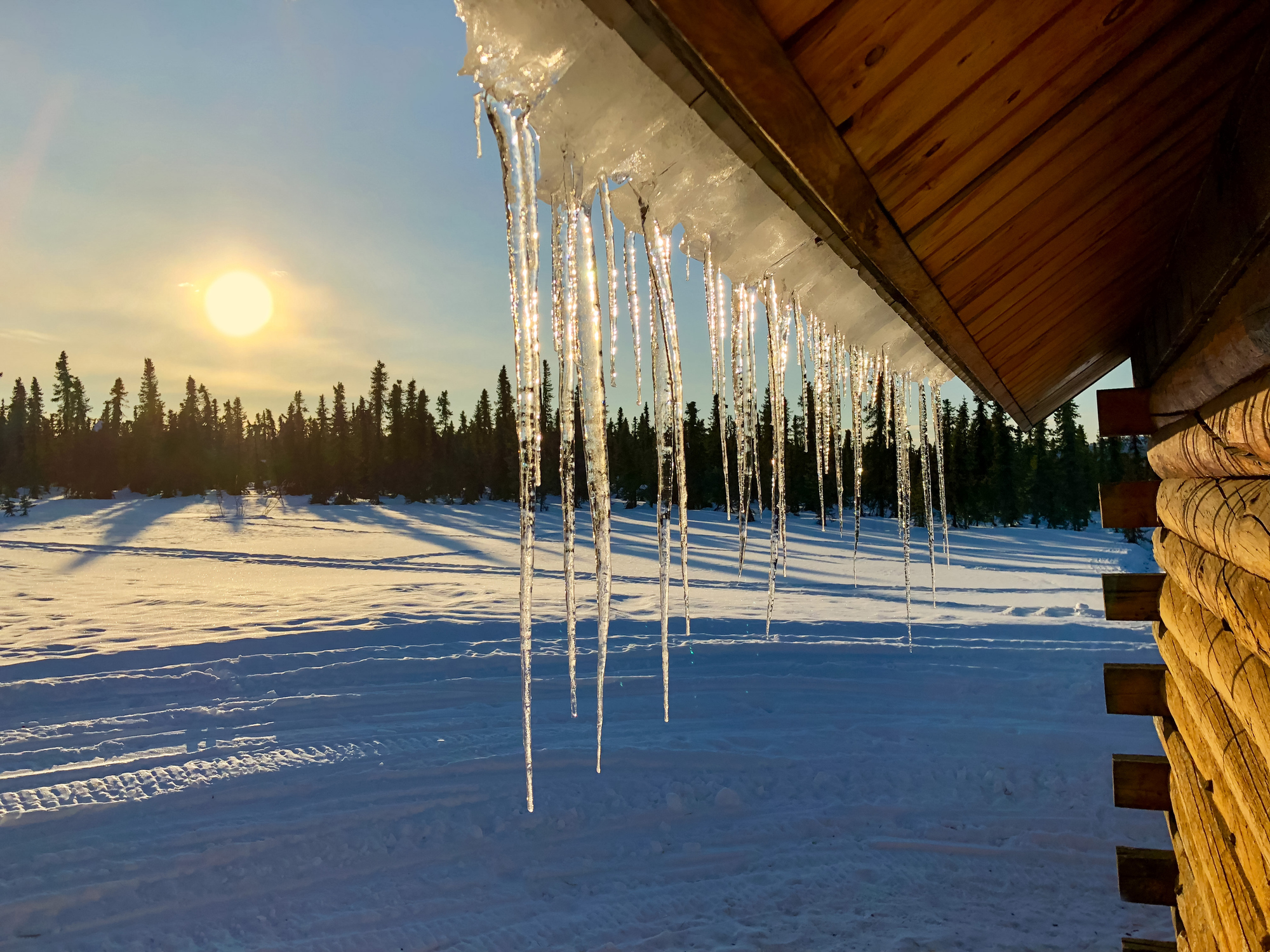 icicles-on-roof-at-sunset