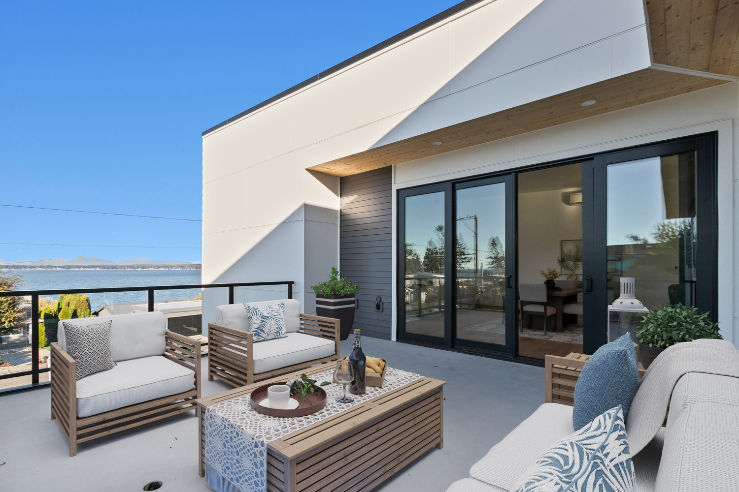 A lovely furnished top-floor balcony overlooking mountain and ocean view