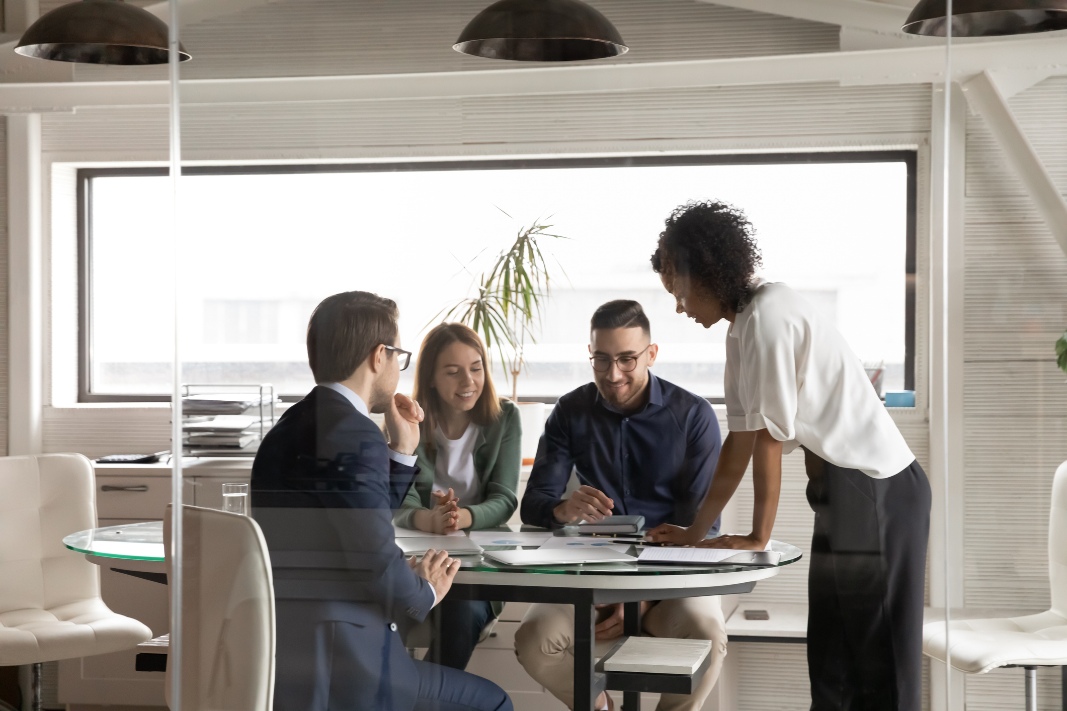 agents collaborating around a table