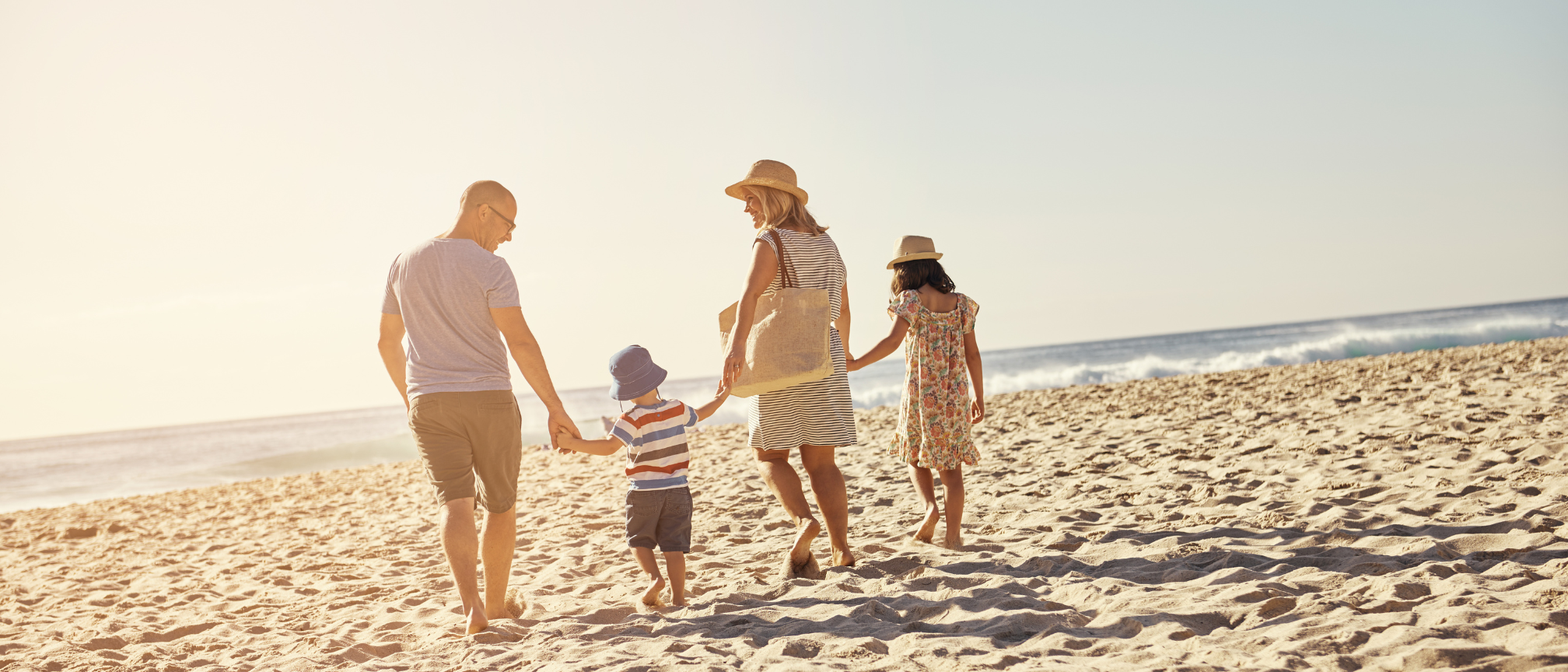 Family walking down to the beach in Florida