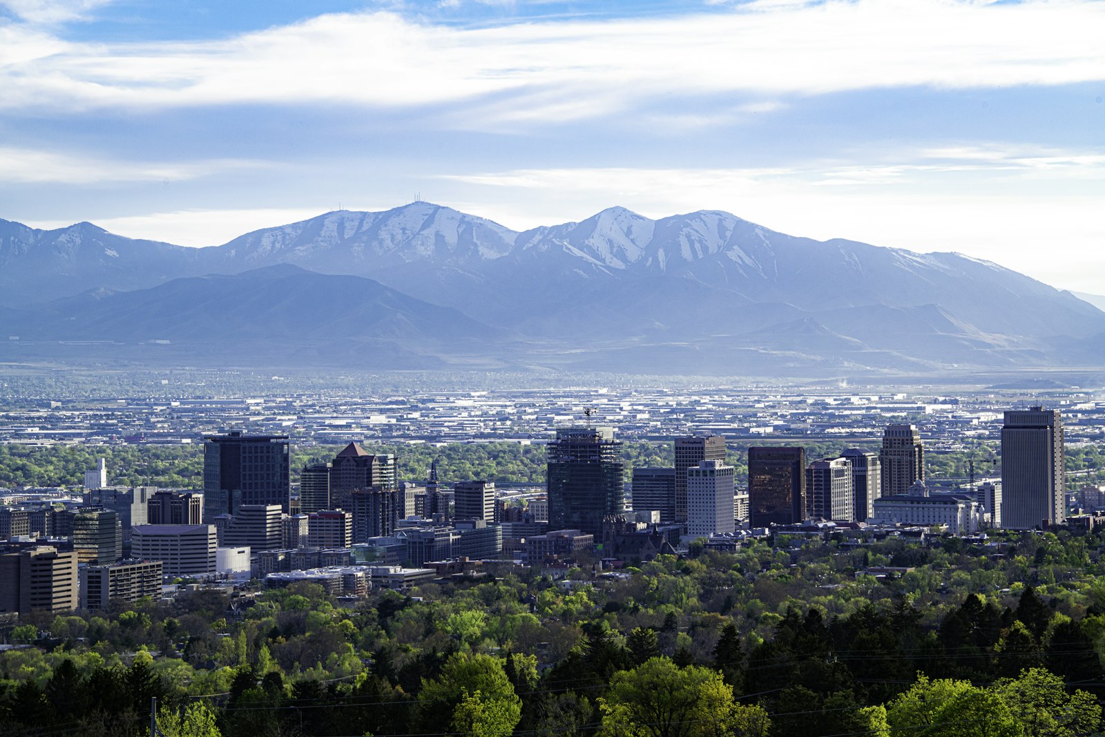 Downtown Salt Lake City skyline in summer with the mountains beyond the valley