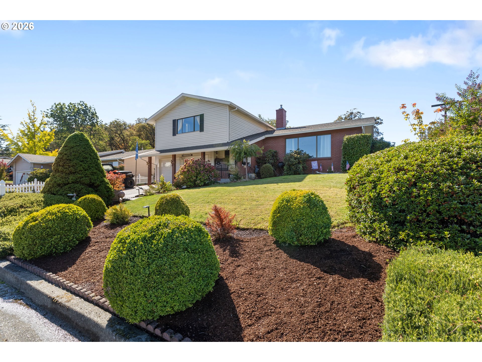 Front exterior and landscaped yard at 2196 NW Andrea St in Roseburg, Oregon