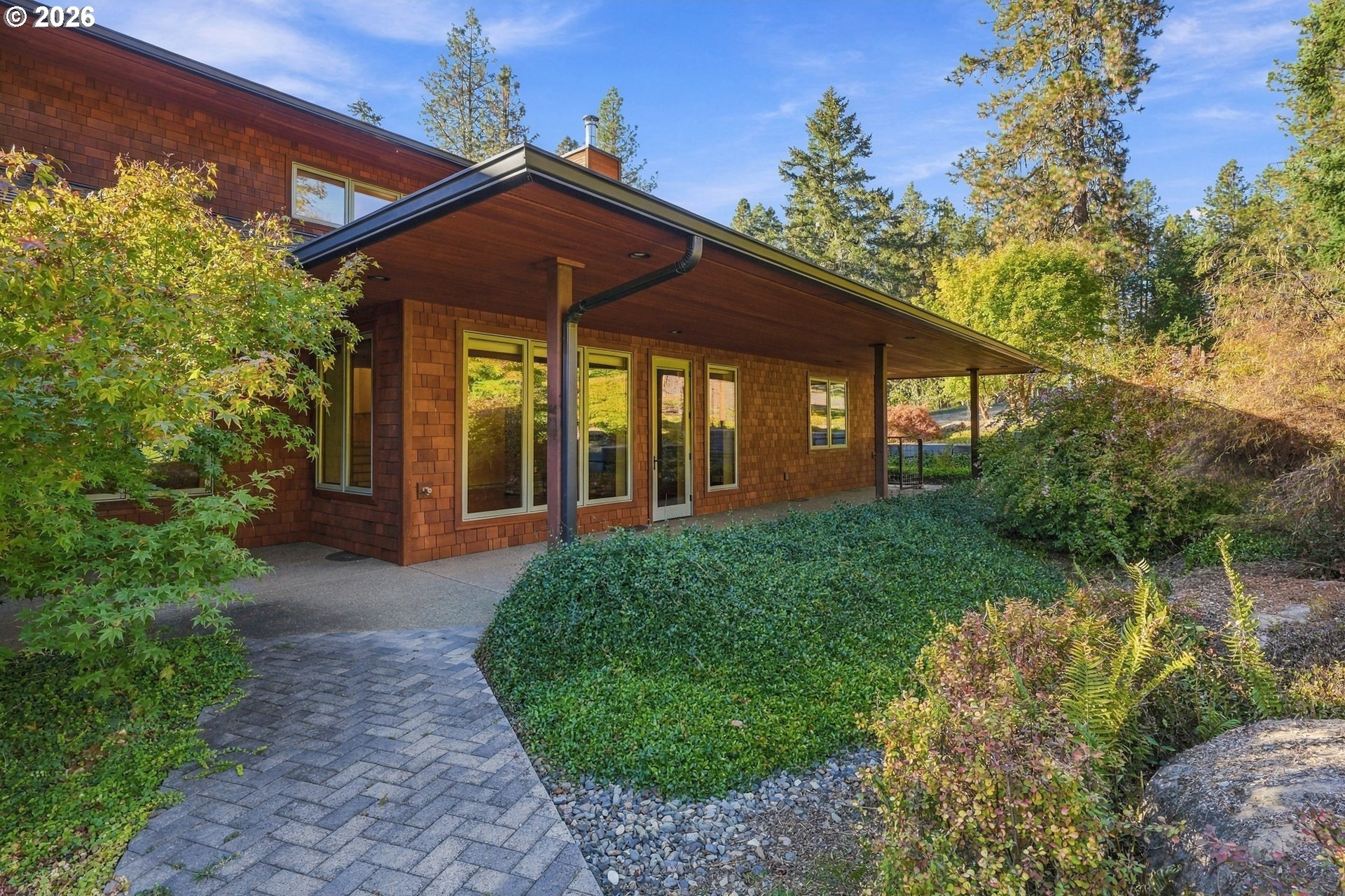 Entry walkway and garden leading to the Mid-Century Modern home at 509 Jasmine Way in Roseburg