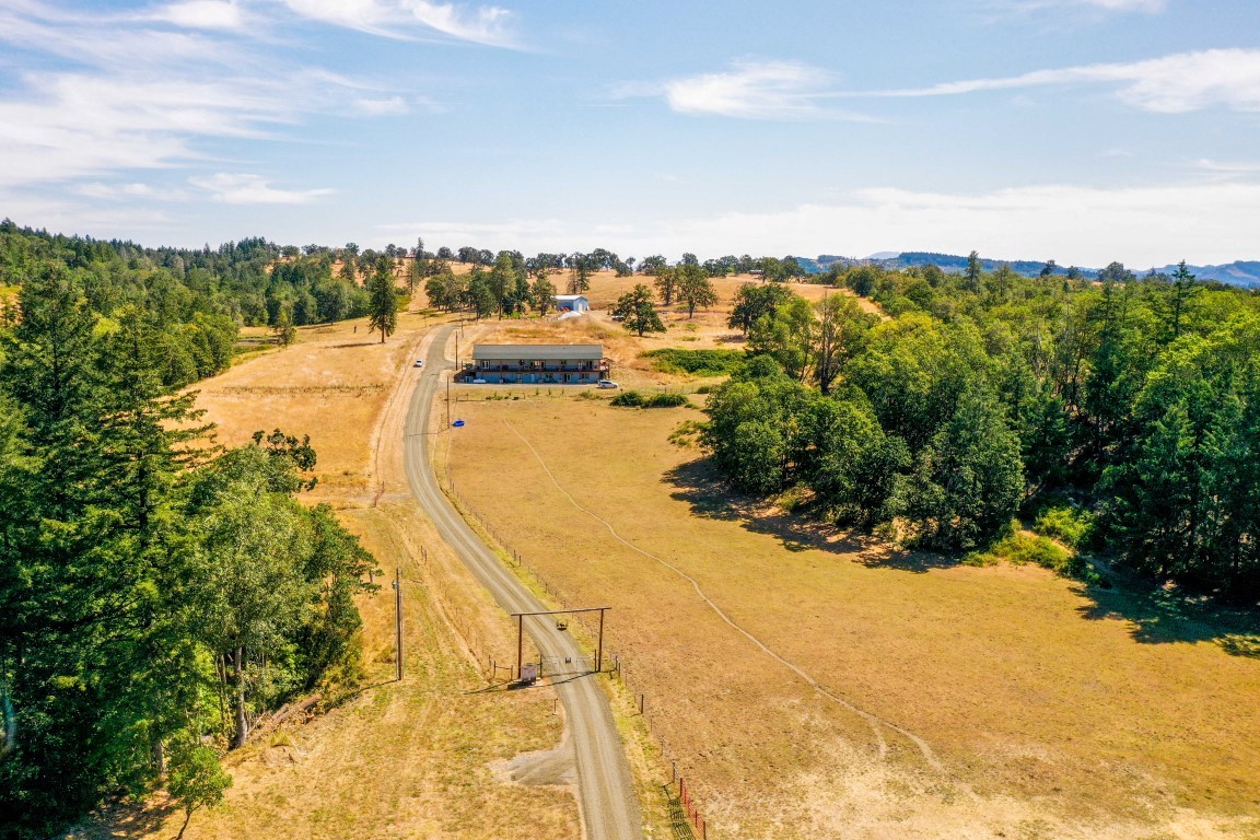 3285 State Highway 138: Custom Lodge Style Home on 230+ Acres! header image.