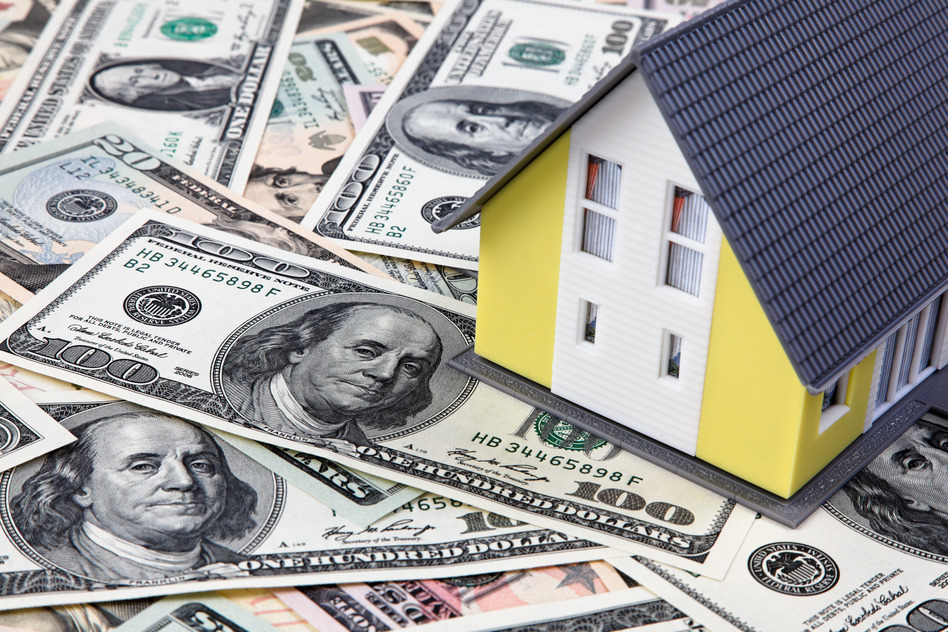 toy house on dollar bills