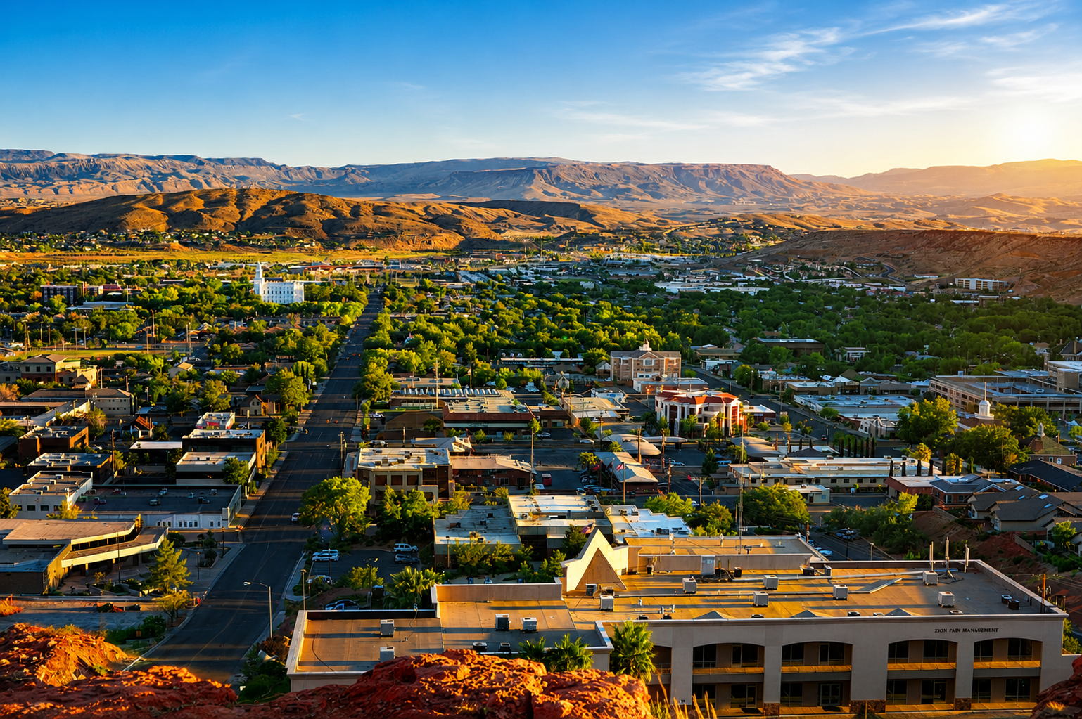Beautiful St. George, Utah community surrounded by red rock cliffs, showcasing the outdoor lifestyle, neighborhoods, recreation, and scenery that attract relocation buyers to Southern Utah.