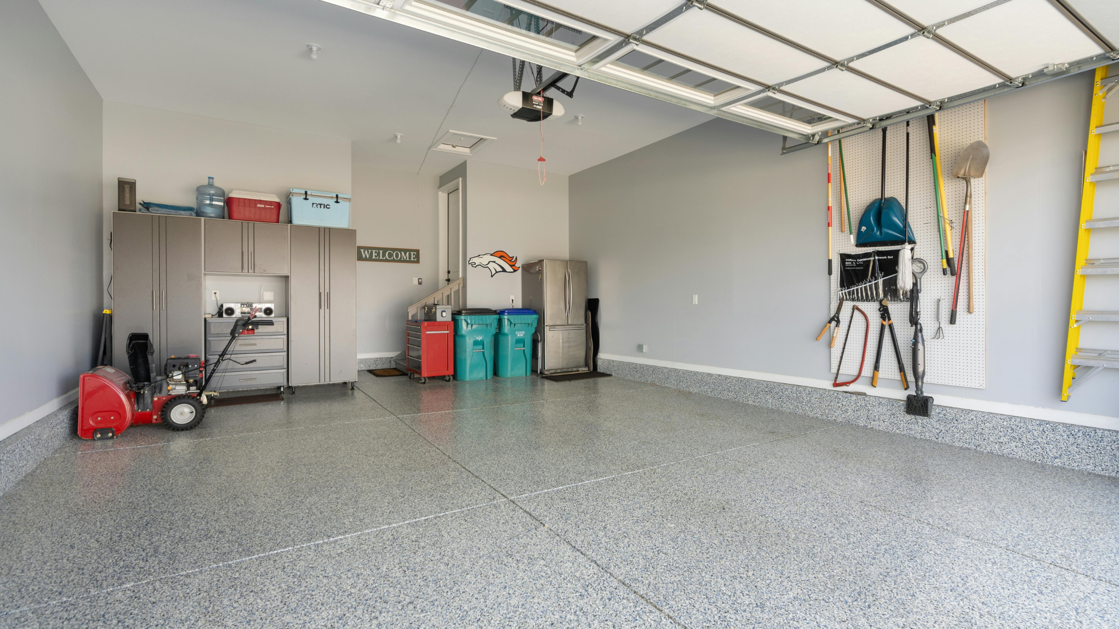 Clean, organized garage with storage and parking space, a popular feature for Bakersfield real estate buyers.