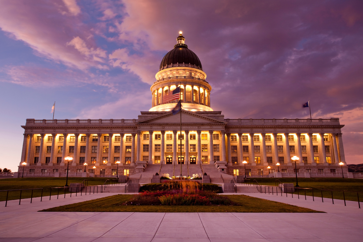 Utah State Capitol building with its iconic dome and 'STATE OF UTAH' inscription, where lawmakers passed housing bills HB37, HB256, and SB181 in 2025 to address affordability crisis through density allowances and regulatory reforms