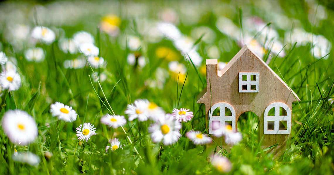 Spring 2025 Utah real estate market – Homes for sale with blooming flowers, representing increasing inventory, stable mortgage rates, and buyer activity.