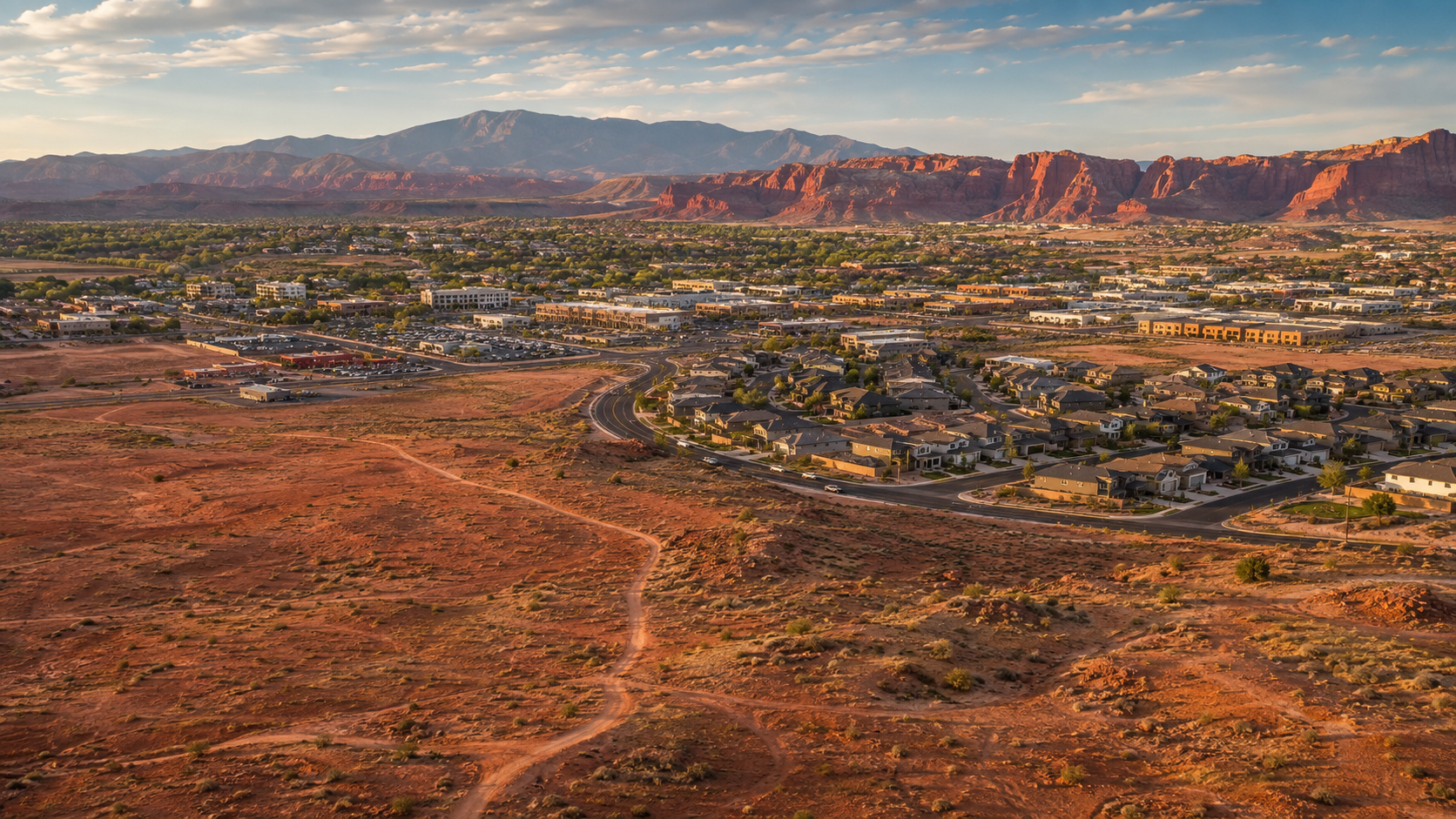 Aerial view of St. George, Utah, showing neighborhoods, roads, and desert land near future housing growth areas