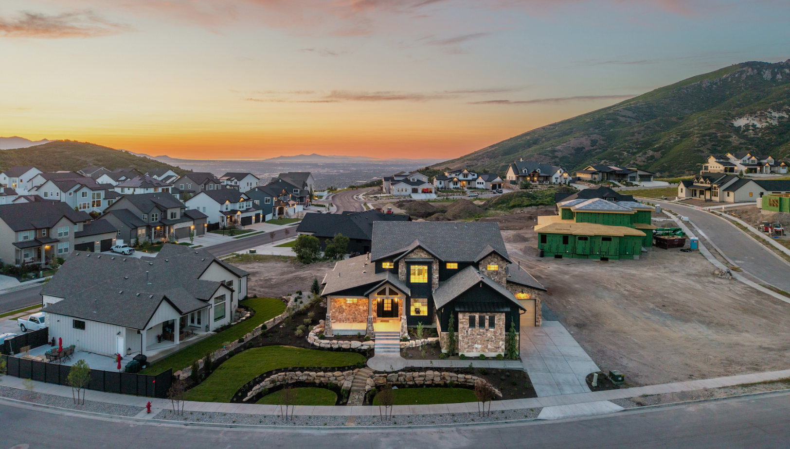 Modern home in Utah with mountain backdrop during spring, representing the best time to sell a home in Utah
