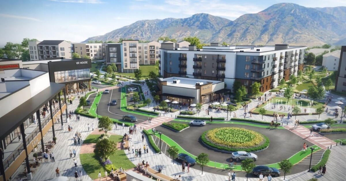 Brixton Capital rendering of the proposed Provo Towne Centre redevelopment, with an outdoor plaza, a landscaped roundabout and new apartment buildings in front of the Wasatch Mountains.