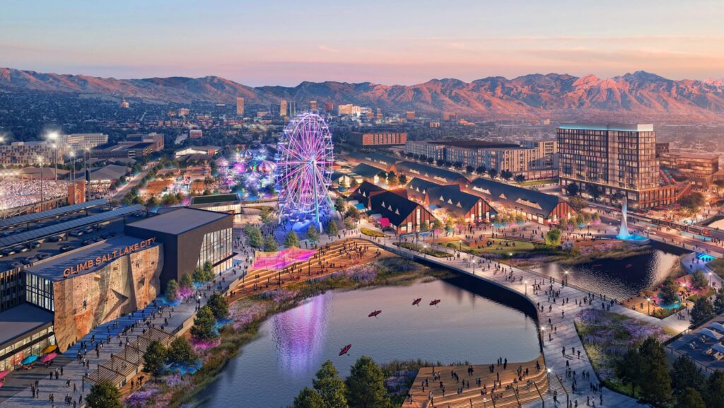 Evening rendering of the Power District riverfront with a Ferris wheel and the Wasatch Mountains behind
