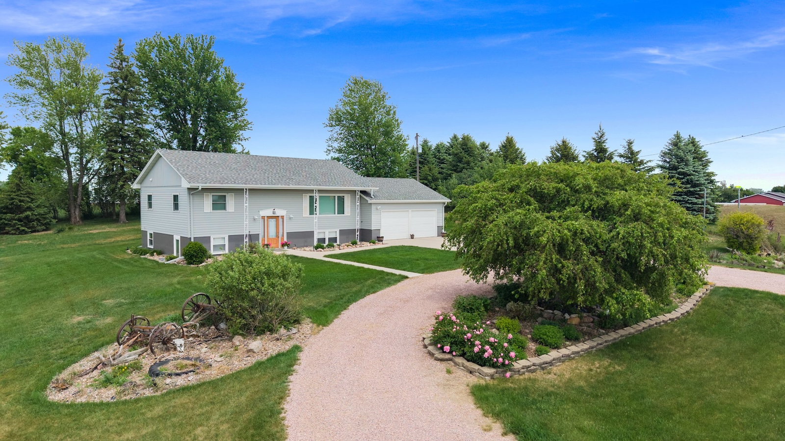 Spacious acreage property on 4.62 acres near Garretson, South Dakota featuring a 3-bedroom, 2-bath home with over 2,200 finished square feet, peaceful country views, and easy access to Sioux Falls.