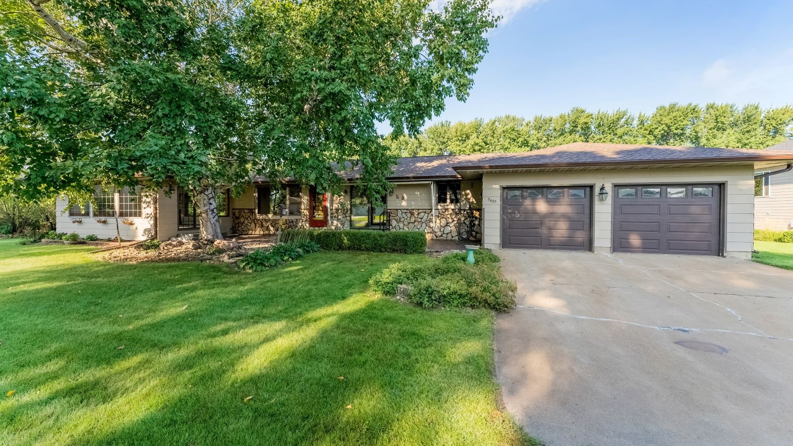 Front exterior of ranch-style home on over one acre in northeast Sioux Falls