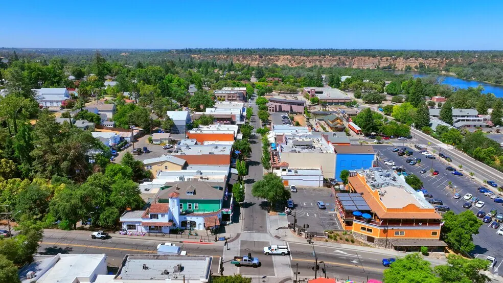 Scenic view of Folsom, California, showcasing the lake, surrounding hills, and suburban homes.