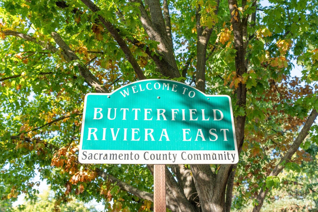 Welcome sign for Butterfield Riviera East neighborhood in La Riviera, a Sacramento County community with tree-lined streets and suburban charm.
