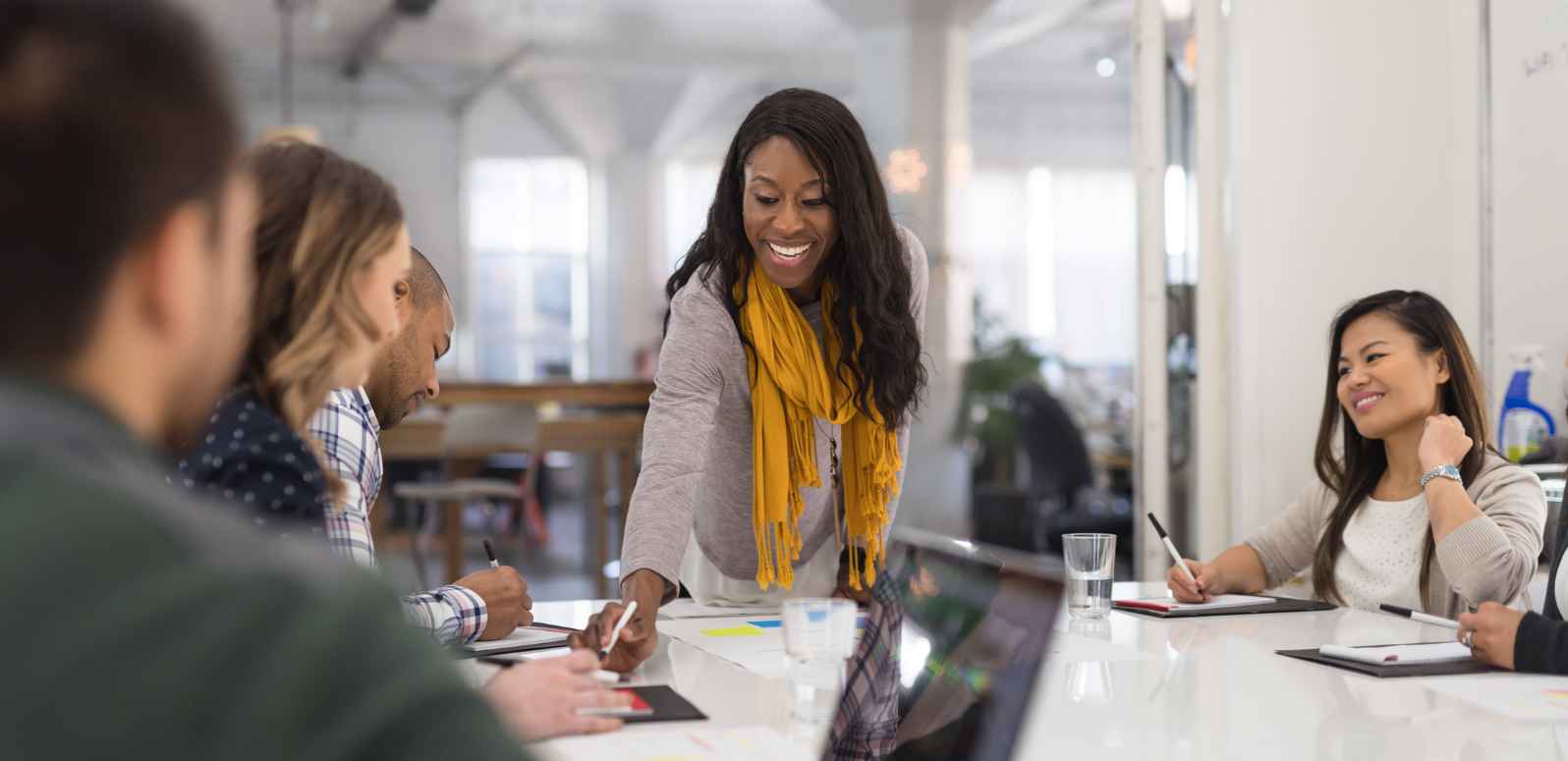 Independent real estate brokerage agent meeting with clients in a local office to discuss buying or selling a home in Bismarck North Dakota