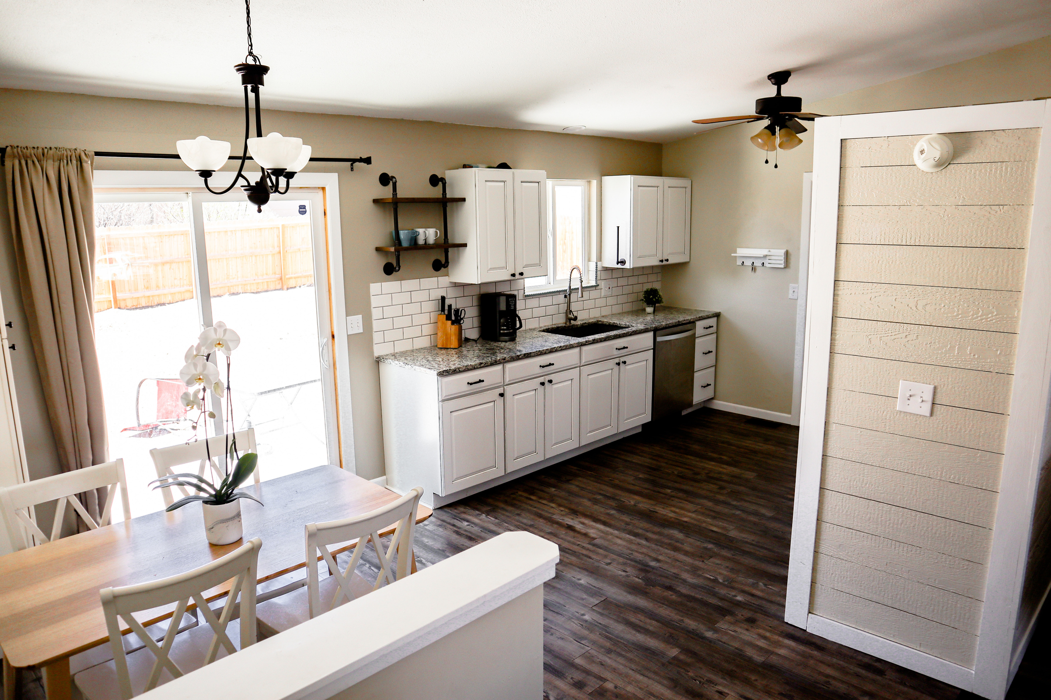 A beautifully staged living room or kitchen in a Colorado Springs home, well-lit with natural light, showing clean lines and a welcoming atmosphere. Should feel aspirational but attainable — not a magazine spread, not a phone snapshot. Consider a 