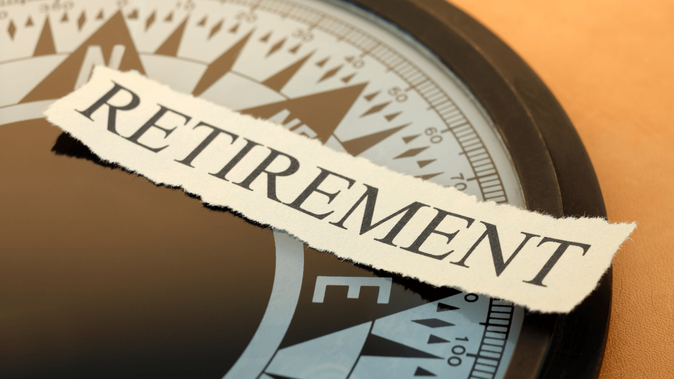 Retirement planning concept with the word ‘Retirement’ placed over a compass, symbolizing financial direction and investment strategy for retirement in Los Angeles real estate.
