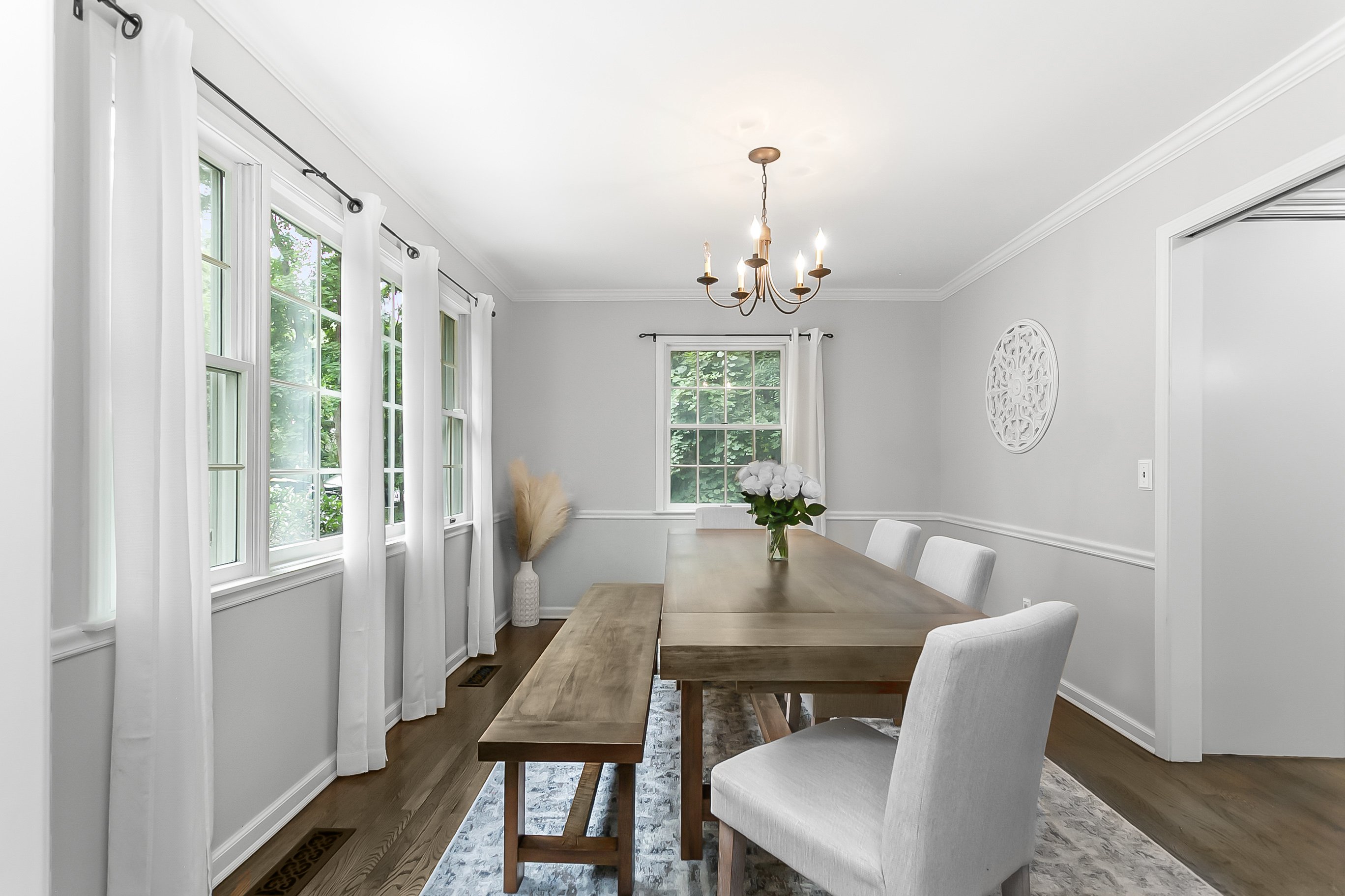 Gray Colonial home with white trim and landscaped front yard at 1320 Merritt Street, Fairfield CT, now under contract