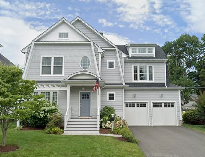 Gray Nantucket-style coastal home with white trim at 824 Riverside Drive, Fairfield CT