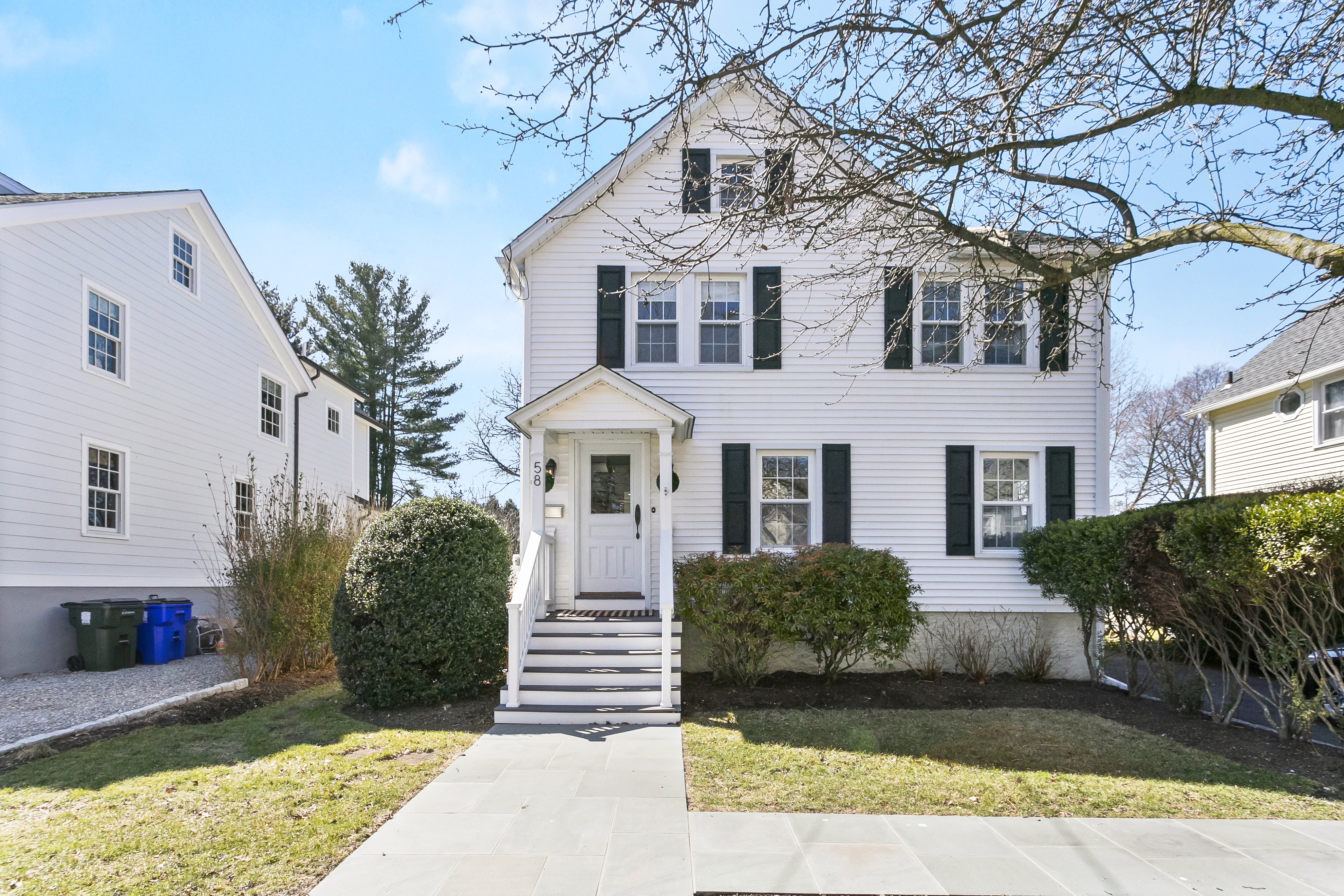 White colonial home with black shutters at 58 Smith Street, Fairfield CT, recently sold