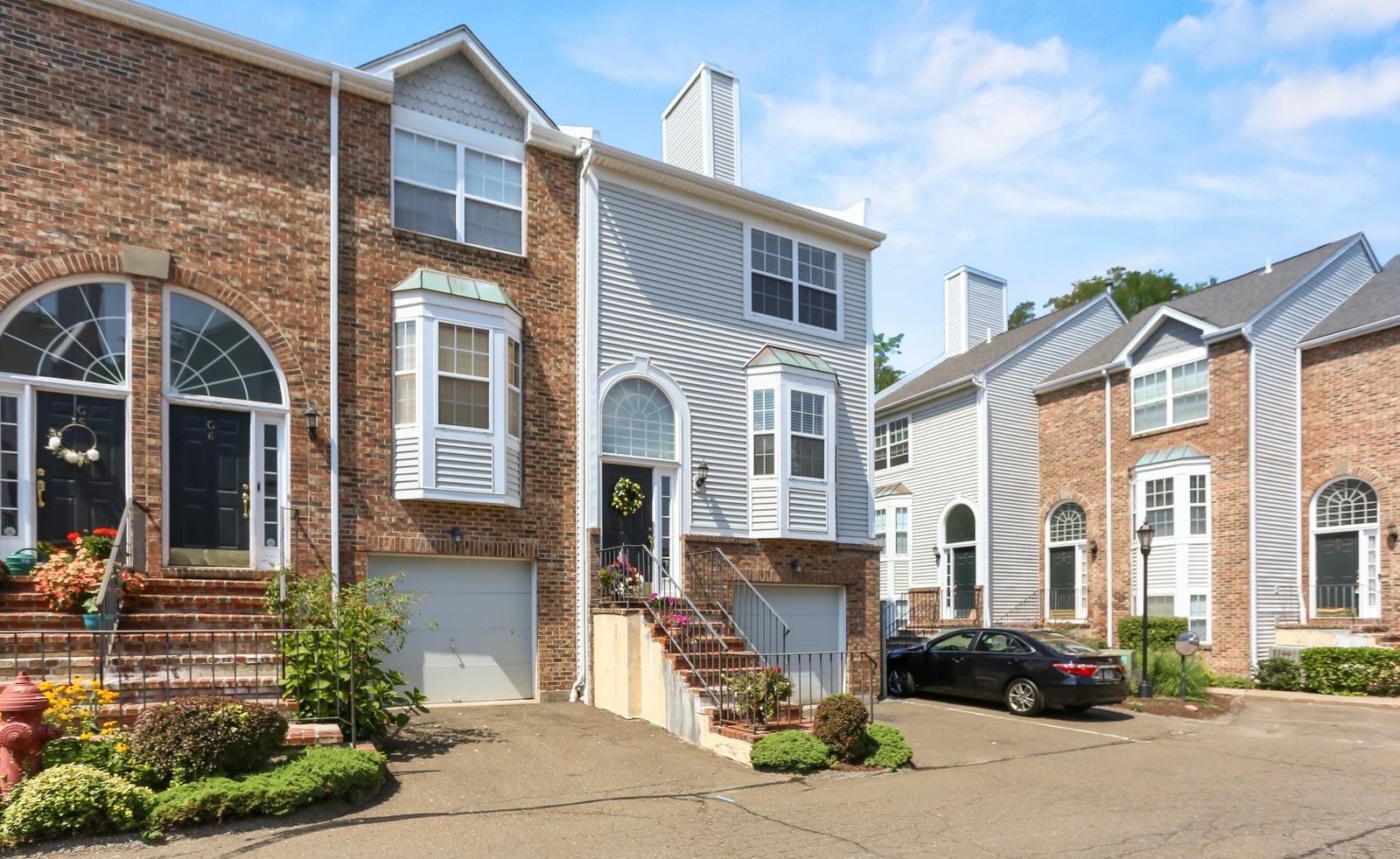 Front exterior of 2612 North Avenue, Unit G7, an end-unit townhome at River's Edge in Bridgeport
