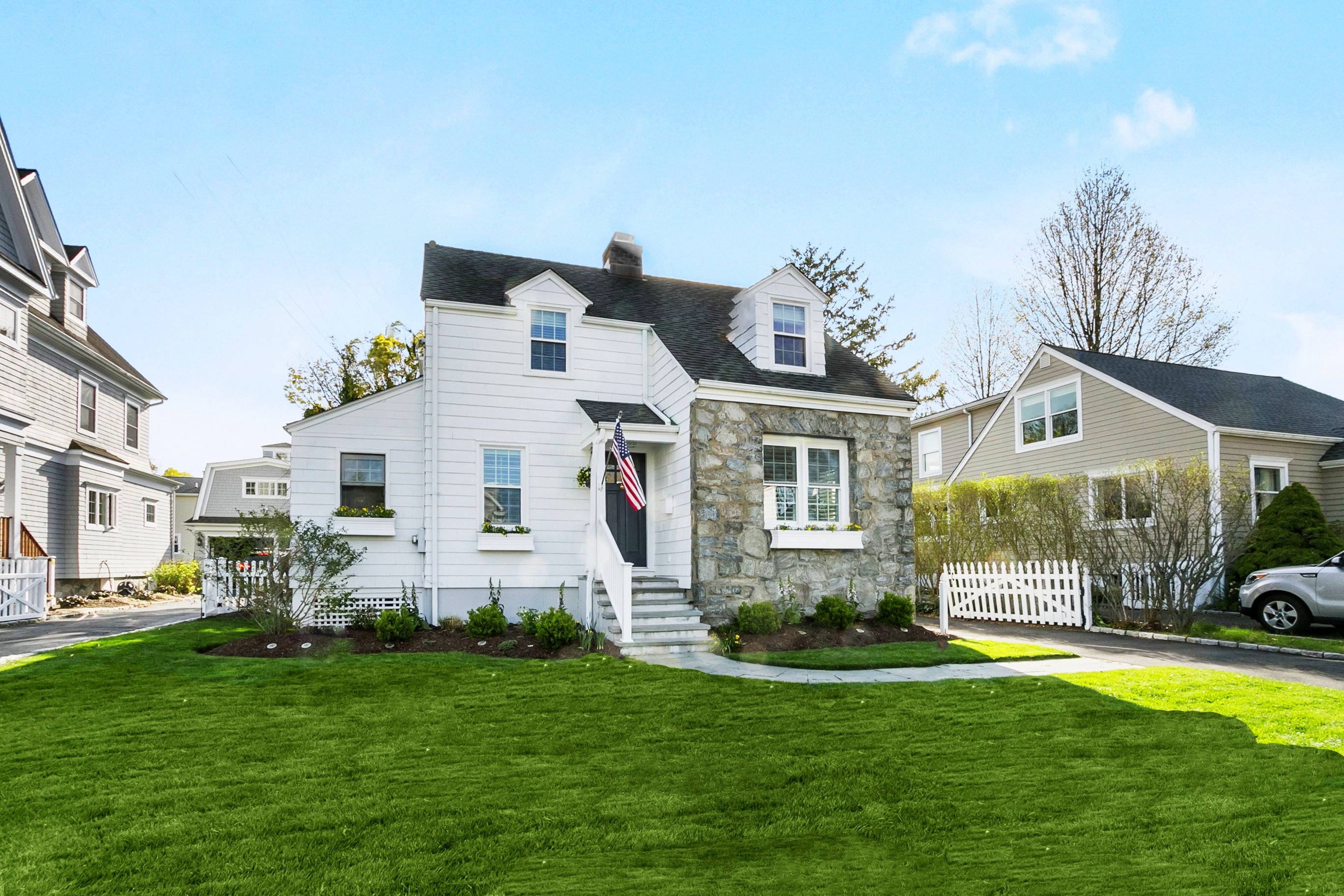 White Cape-style home with dark shutters at 162 Eastlawn Street, Fairfield CT, recently sold