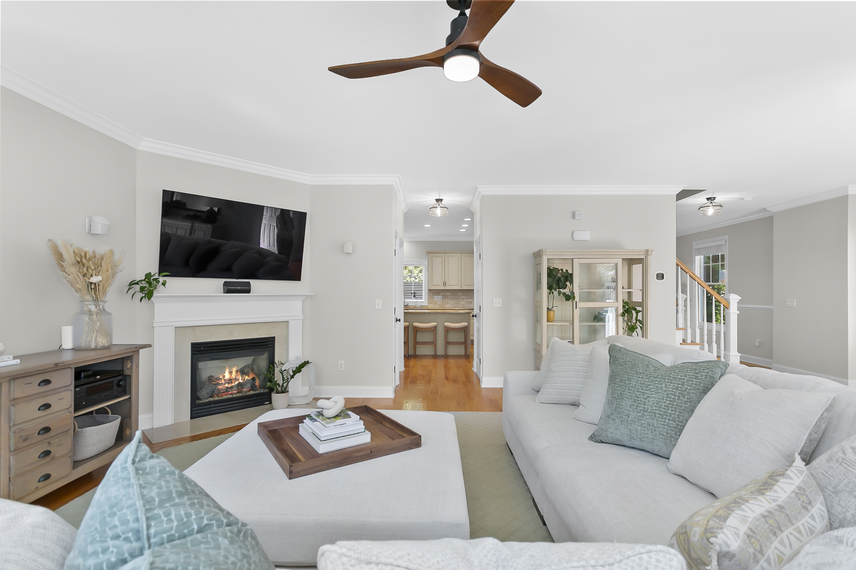 Living room with gas fireplace and coastal furnishings at 24 Warsaw Street, Fairfield CT