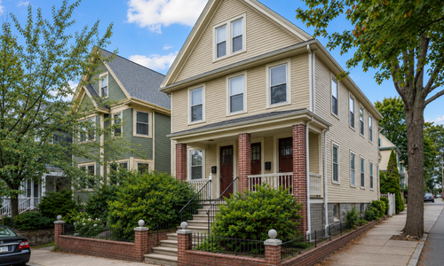 Street-level exterior of a Somerville MA multifamily home illustrating a potential condo conversion property.