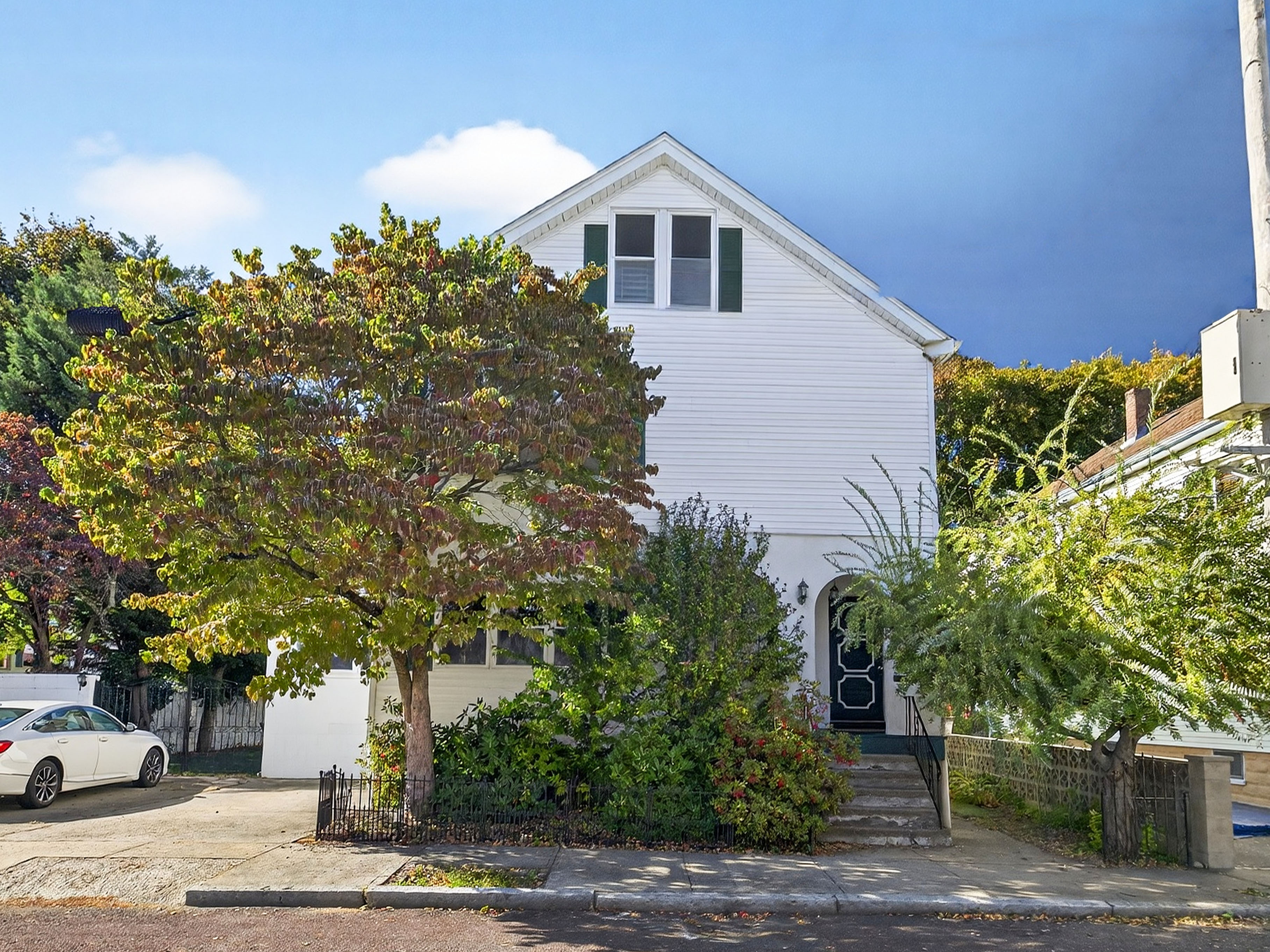 Medford MA condo exterior with front yard and entry, example of a home successfully sold after spring relaunch