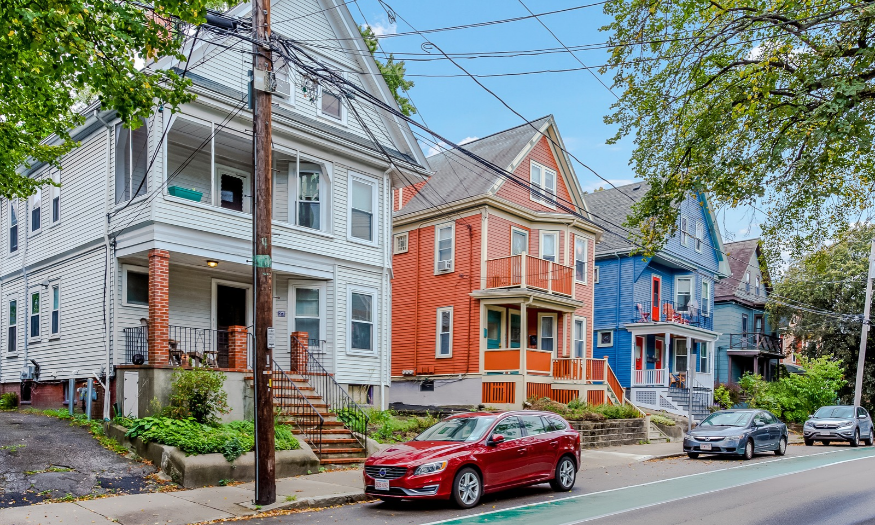 Residential homes along a tree-lined street in Cambridge, Massachusetts