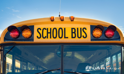 Yellow school bus in Greater Boston suburb, symbolizing family life and top-ranked schools