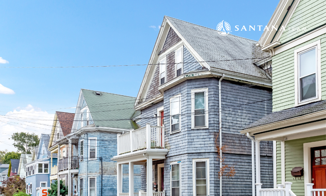 Classic Somerville triple decker homes illustrating dense housing and condo inventory in 2026