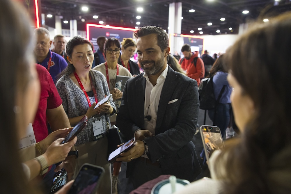 Hudson Santana connecting with attendees after speaking at real estate conference