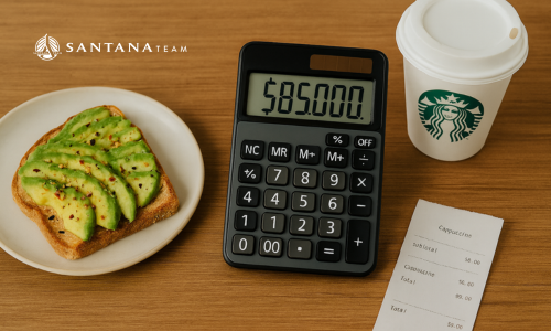 Flat lay with avocado toast, Starbucks coffee cup, receipt for $6 latte, and calculator displaying $85,000 symbolizing real home buying costs in Boston.