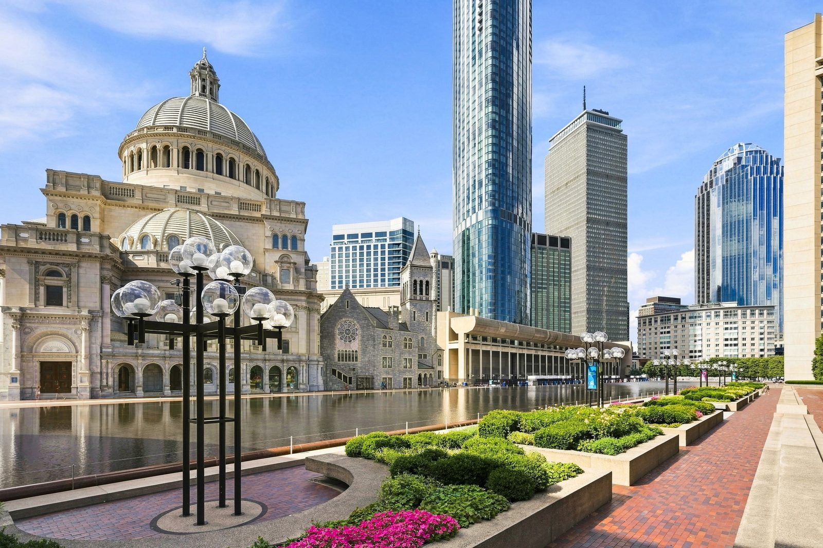 One Dalton's glass tower rising behind the Mother Church and reflecting pool at Christian Science Plaza in Back Bay