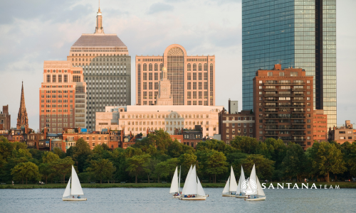 Boston skyline with sailboats on the Charles River, representing Greater Boston real estate and the Santana Team