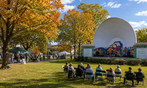 Fall community event at Condon Shell in Medford, Massachusetts, with live music, local vendors, and colorful autumn foliage.