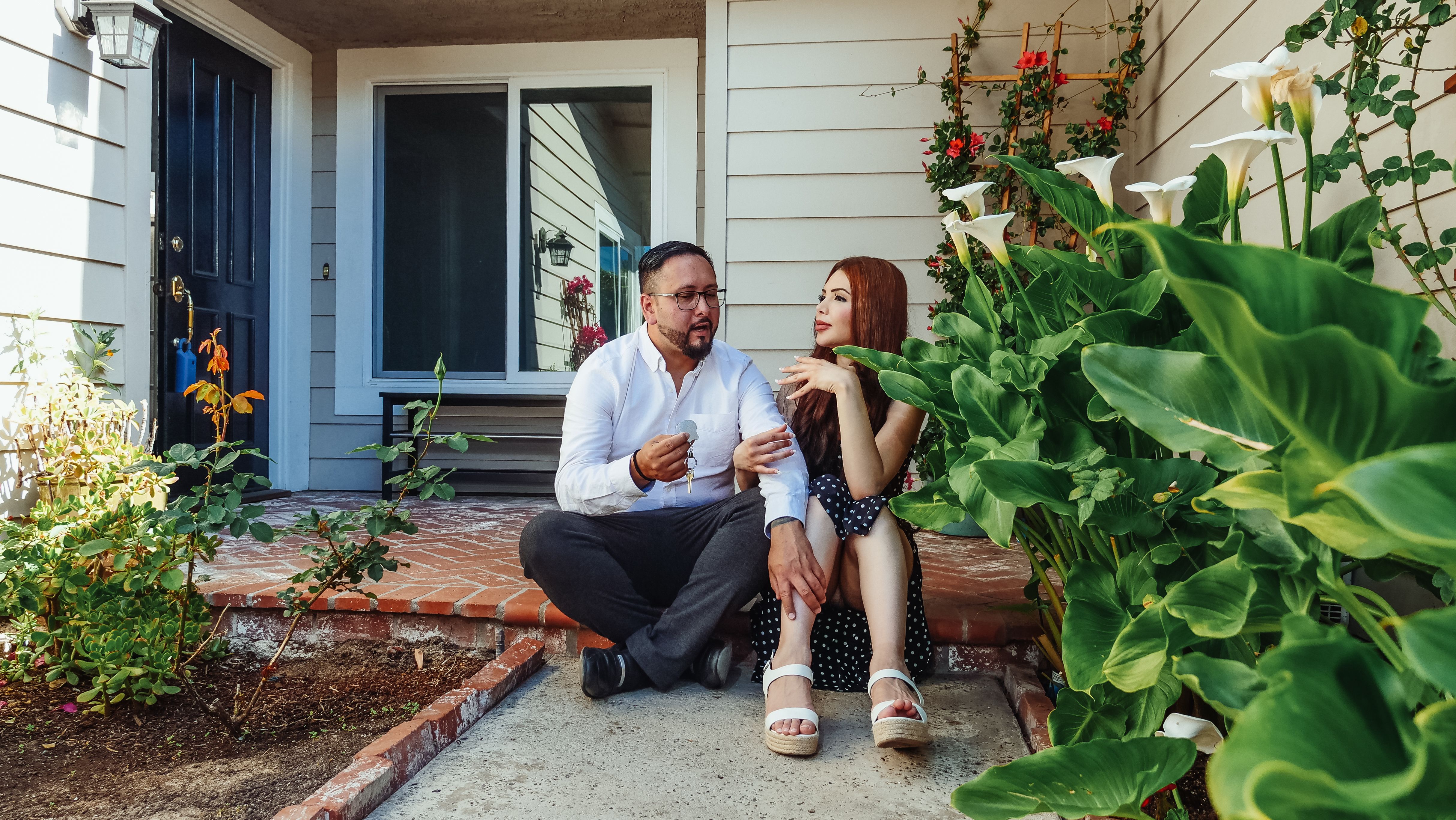 Couple Sitting on Porch discussing selling home