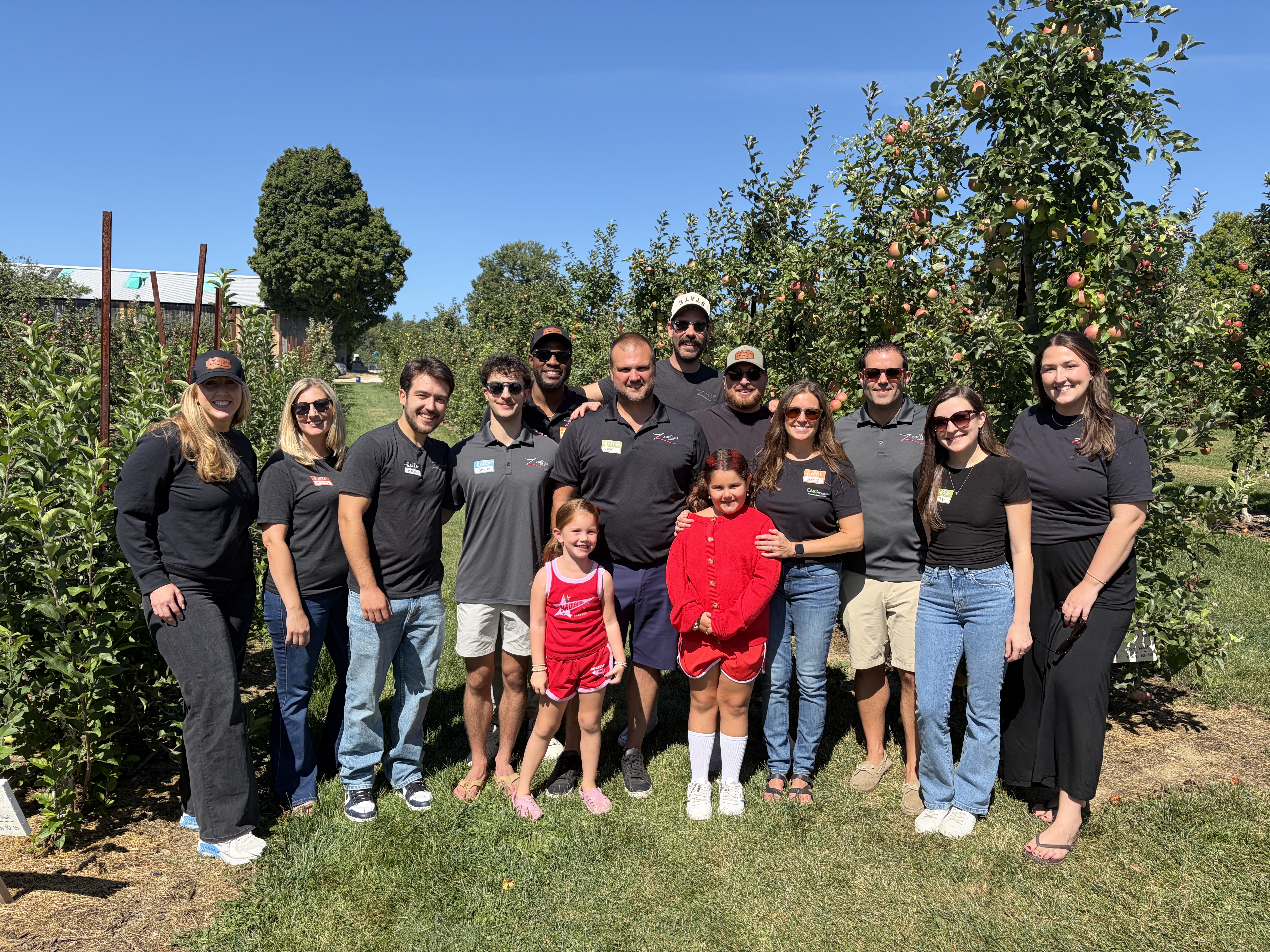 The Zoeller Group real estate team at their annual client apple picking event at Butternut Farm in Farmington, New Hampshire.
