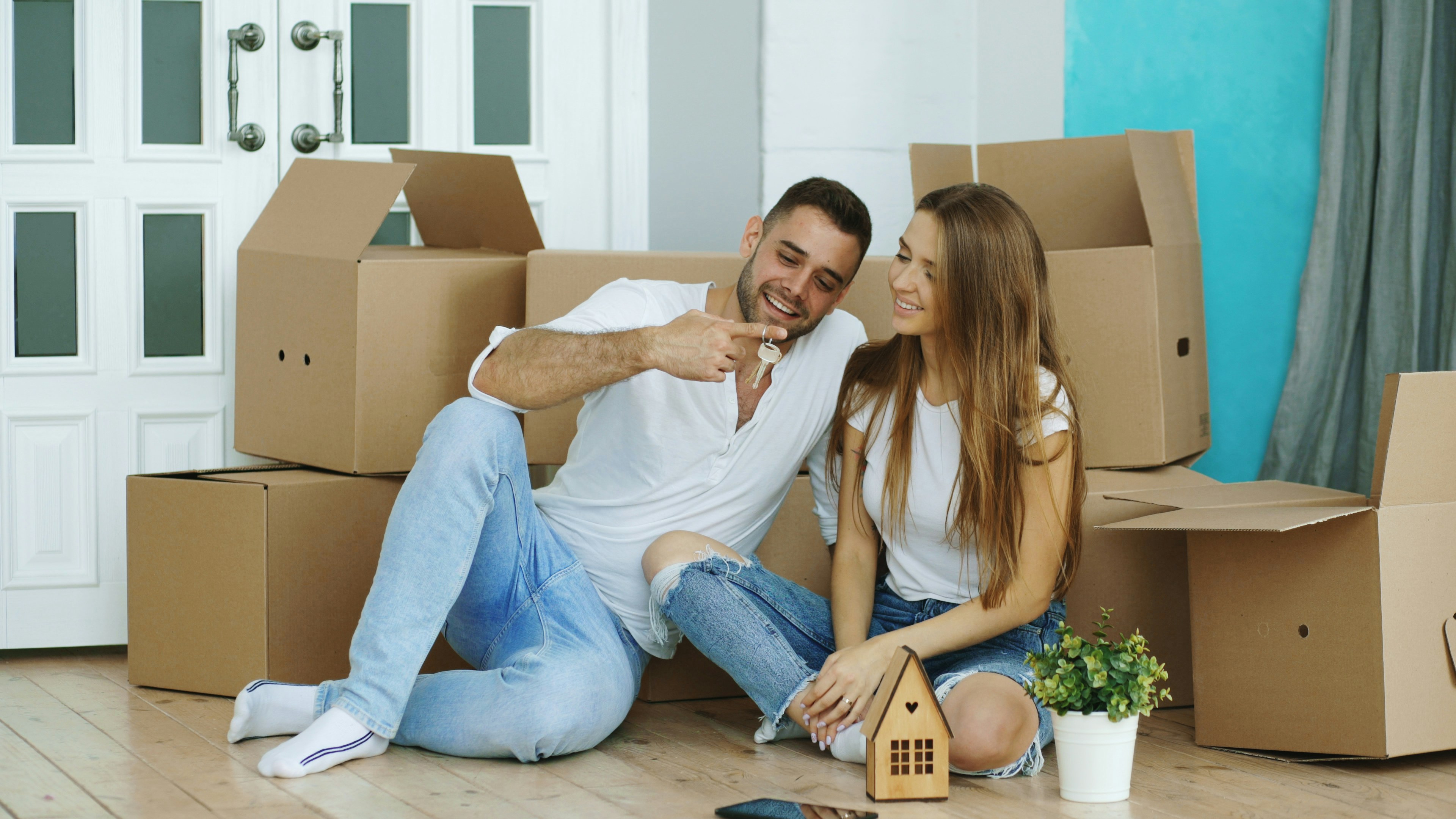 Young couple with moving boxes