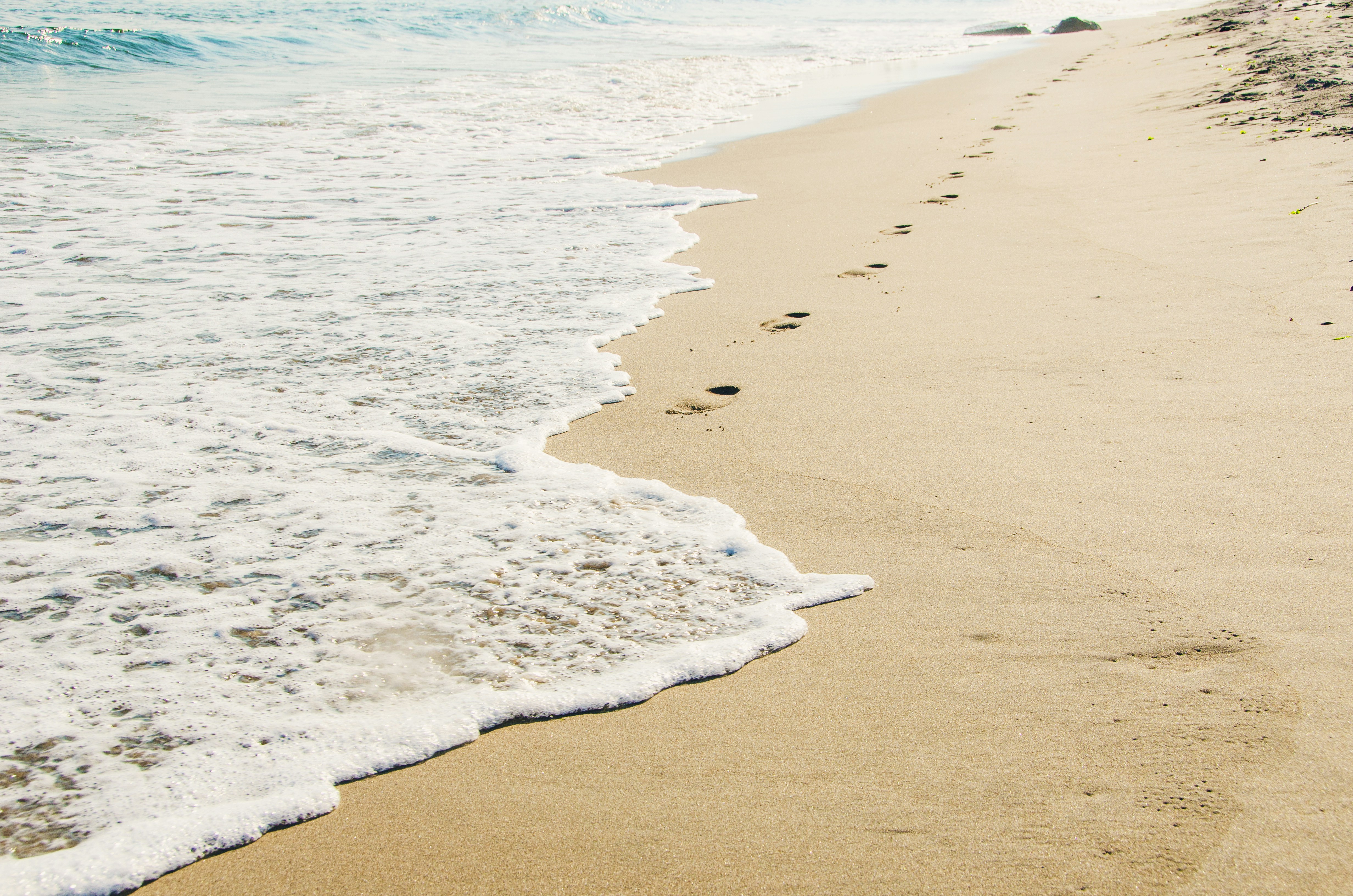 Waves on beach sand 