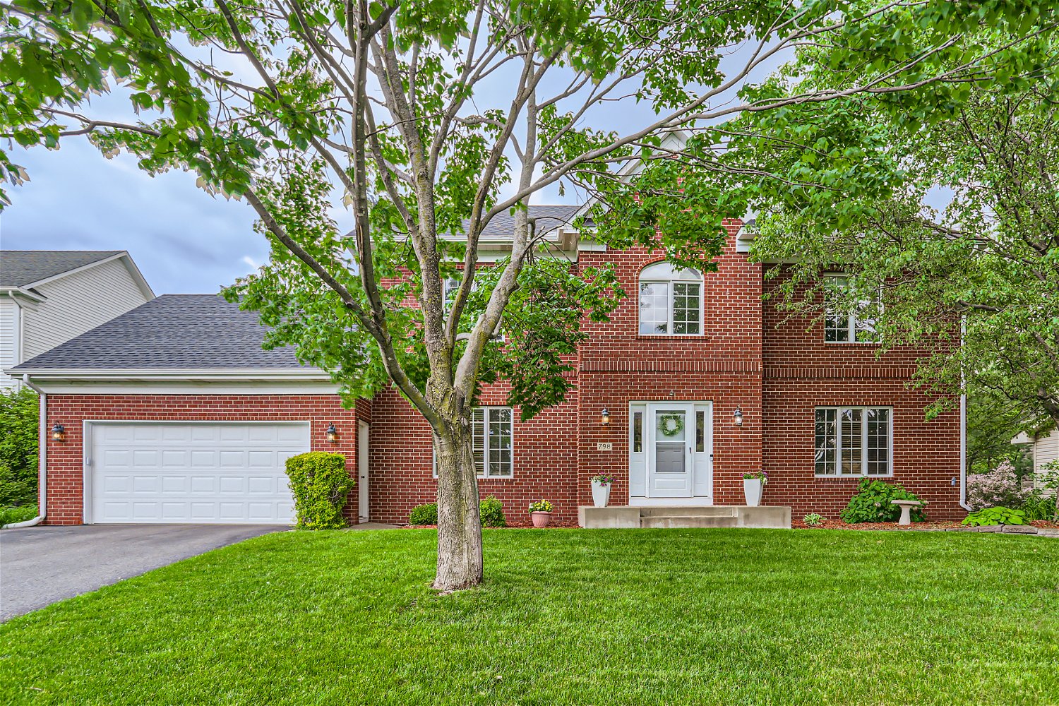 The 2-story brick home you never knew you needed until now! header image.