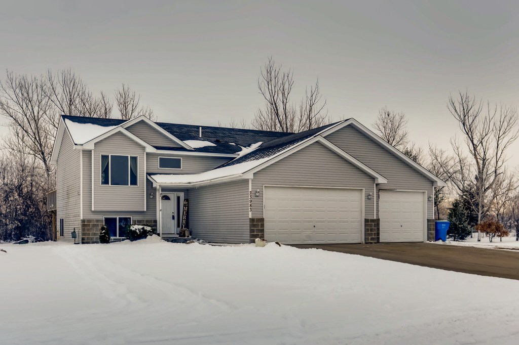Privacy with this home for sale in East Bethel on 2.72 acres! SOLD! header image.